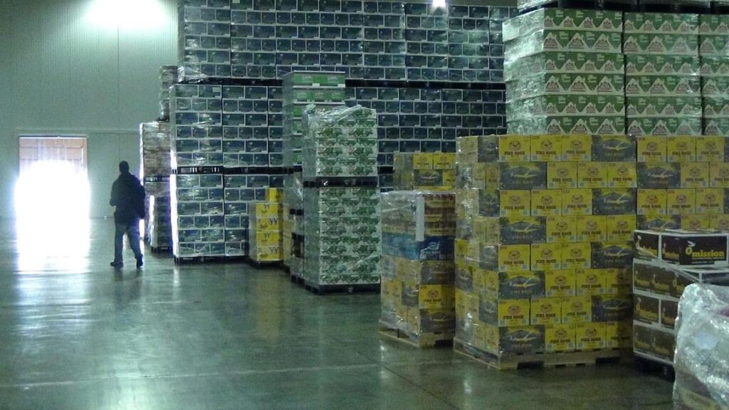 Pallets of packaged beverages stored inside a temperature-controlled warehouse