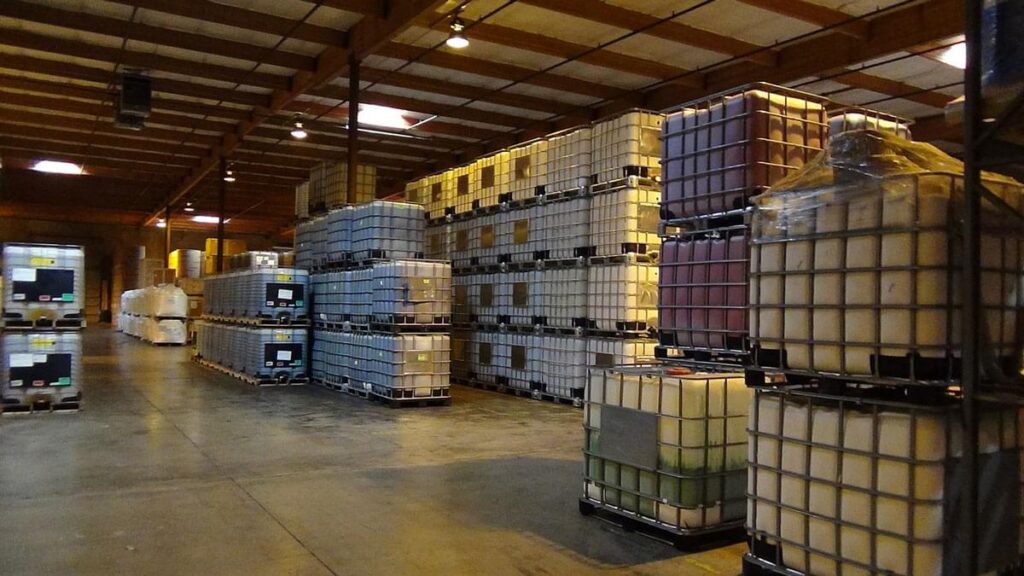 Stacked bulk containers organized inside a Wymore Transfer warehouse